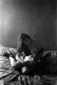 7_Joseph Rodriguez, Norma breastfeeding her daughter before she starts to work. La Merced, Mexico City 1997, copyright Joseph Rodriguez.jpeg