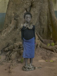 Nahaume Ouielle, 8 ans, with Daba Dre Snakes, Temple Des Pythons, Ouidah, Benin, 2011.jpg