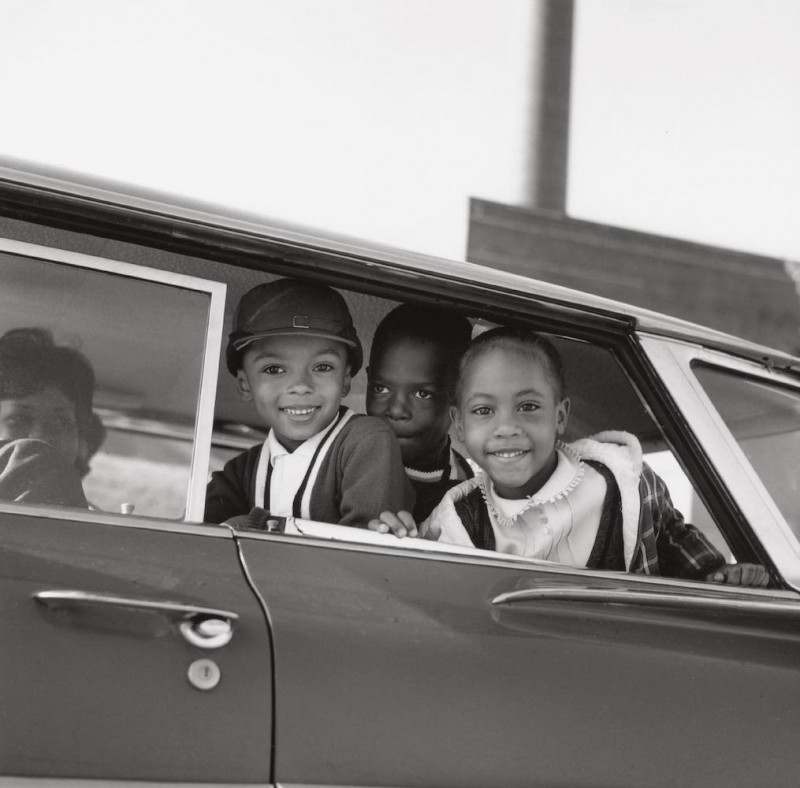 4_Michael Willis, Harry Williams, and Dwania Kyles sit in the back of a car during the first day of Memphis school integration, 1961