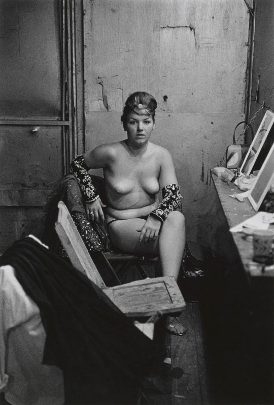 11. Stripper with bare breasts sitting in her dressing room, Atlantic City, N.J. 1961